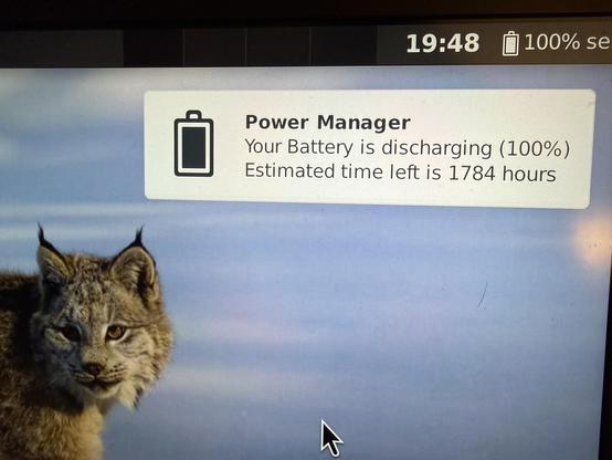 A pop dialog saying “Power Manager”, and “Your battery is discharging. Estimated time left is 1784 hours”